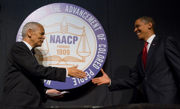 US President Barack Obama shakes hands with NAACP chairman Julian Bond (L) during the NAACP 100th Anniversary convention in New York, July 16, 2009. AFP PHOTO / Saul LOEB (Photo credit should read SAUL LOEB/AFP/Getty Images)